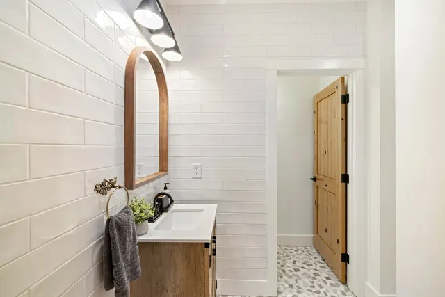 a view of balcony with wooden floor and outdoor seating