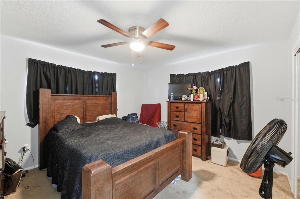 54 Gardner Avenue Lake Wales, FL 33898 - Photo 13 of 25 a living room with furniture and a closet