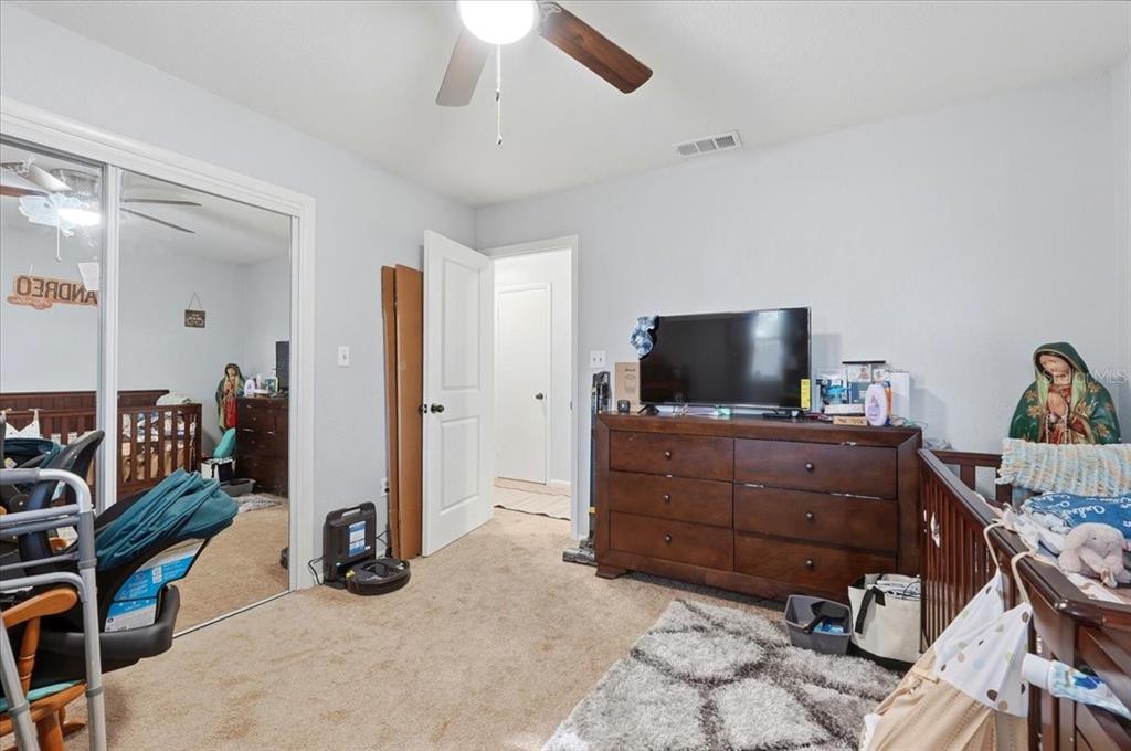 54 Gardner Avenue Lake Wales, FL 33898 - Photo 14 of 25 a room with furniture and a flat screen tv