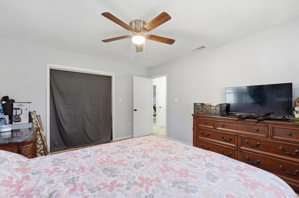 54 Gardner Avenue Lake Wales, FL 33898 - Photo 16 of 25 a bedroom with a bed and a flat screen tv