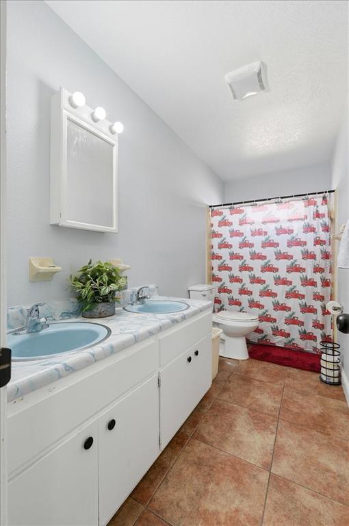 54 Gardner Avenue Lake Wales, FL 33898 - Photo 18 of 25 a bathroom with a sink and a mirror