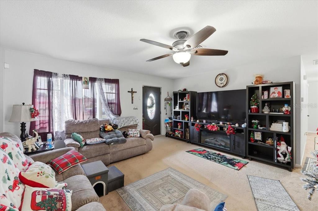 54 Gardner Avenue Lake Wales, FL 33898 - Photo 3 of 25 a living room with lots of furniture and a window