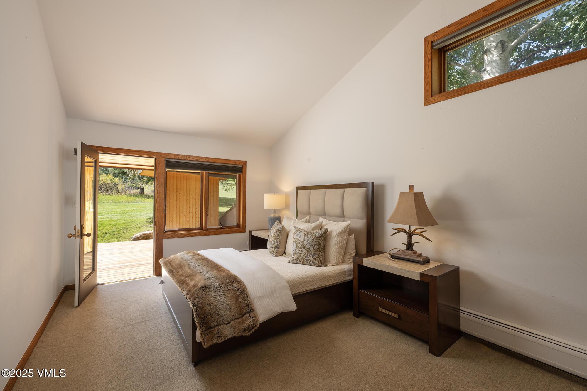 304 Meadow Road Edwards, CO 81632 - Photo 15 of 25 a bedroom with a bed and large windows