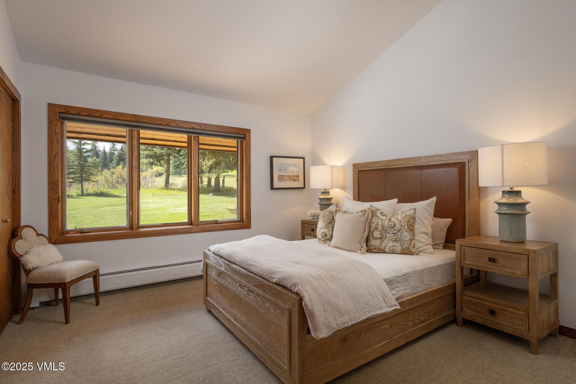 304 Meadow Road Edwards, CO 81632 - Photo 16 of 25 a bedroom with a bed and a couch next to a window