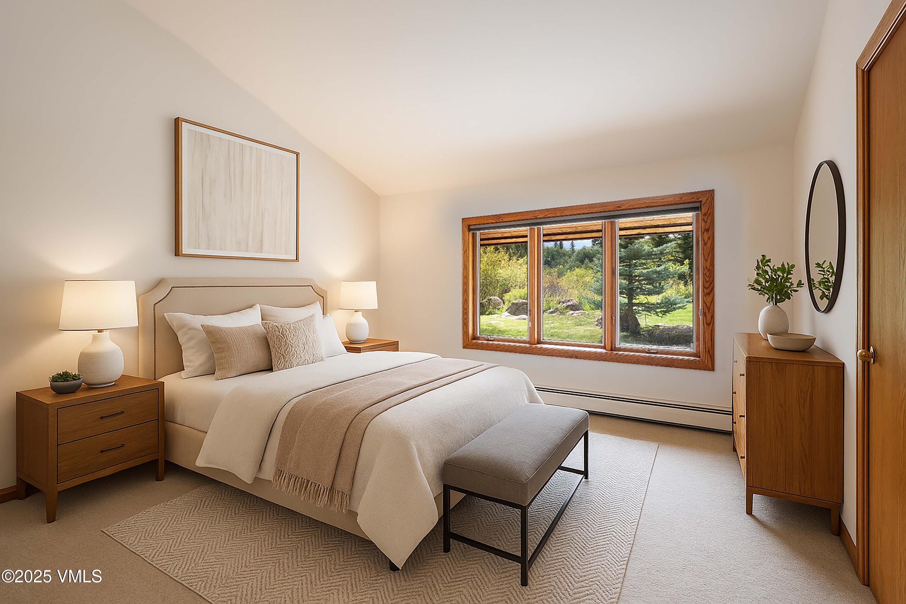 304 Meadow Road Edwards, CO 81632 - Photo 17 of 25 a bedroom with a bed and a large mirror next to a window