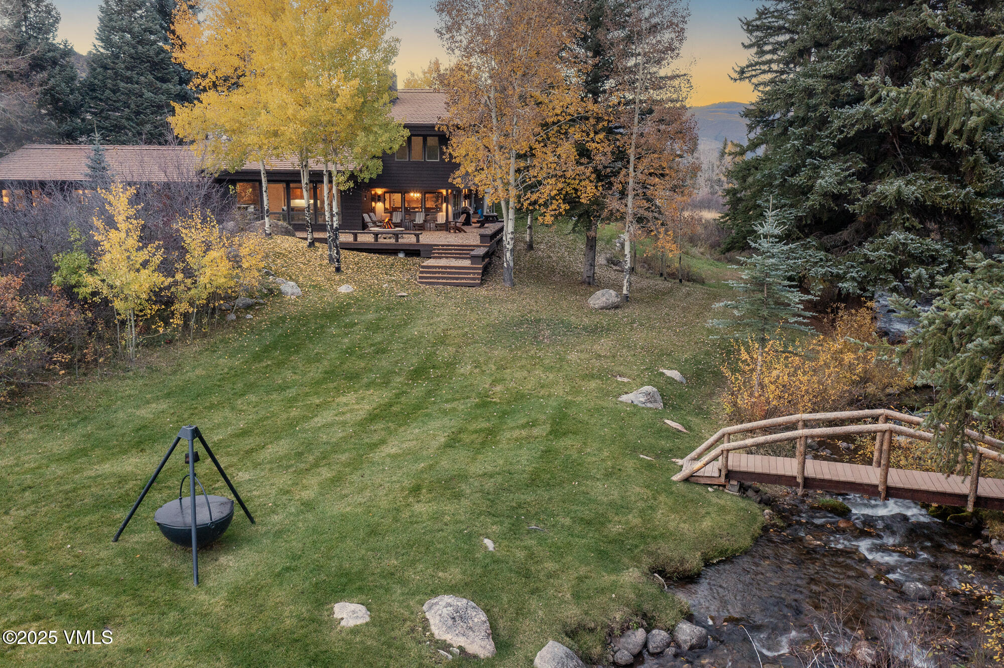 304 Meadow Road Edwards, CO 81632 - Photo 20 of 25 a backyard of a house with table and chairs
