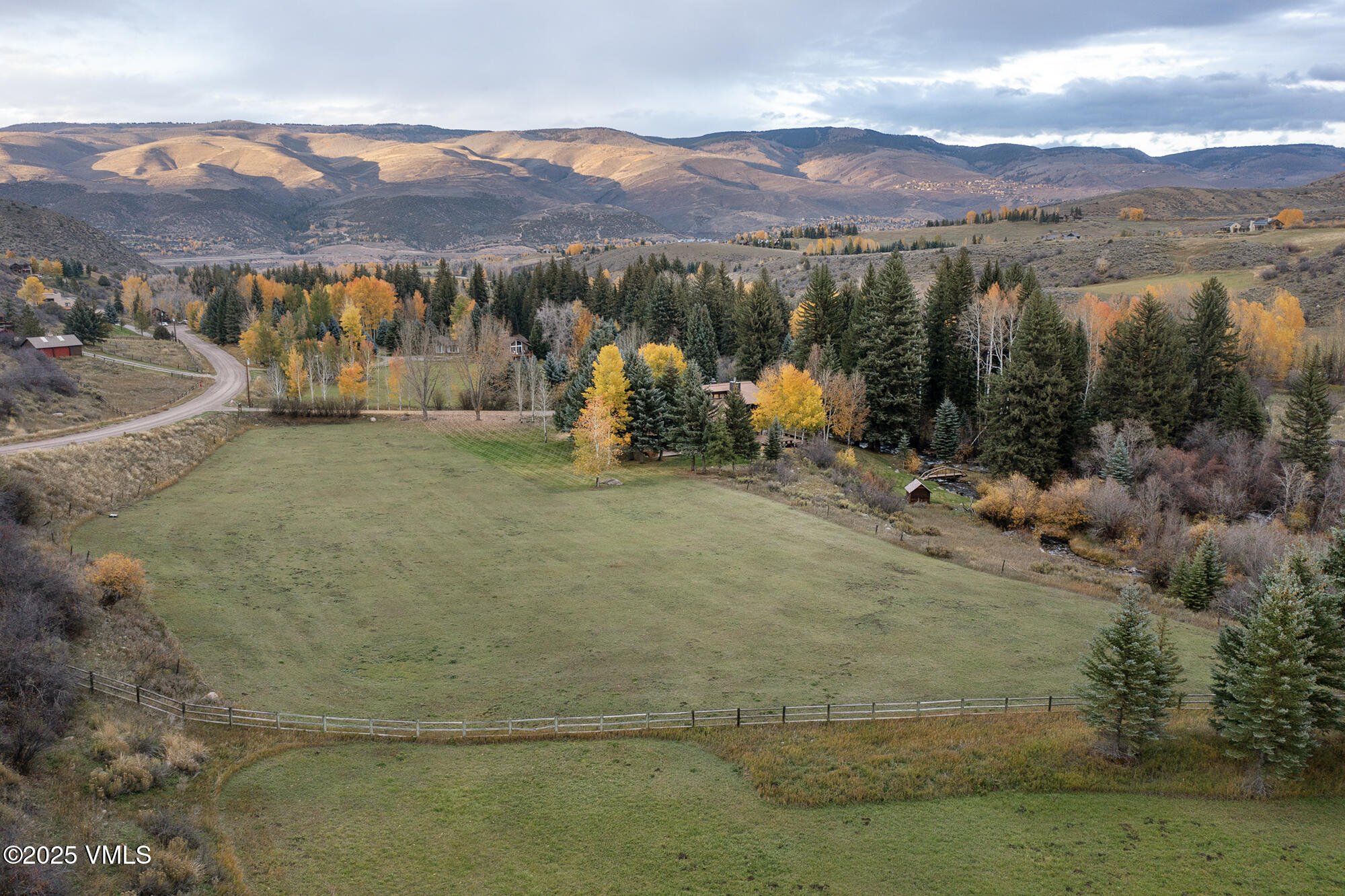 304 Meadow Road Edwards, CO 81632 - Photo 21 of 25 a view of a town with mountains in the background