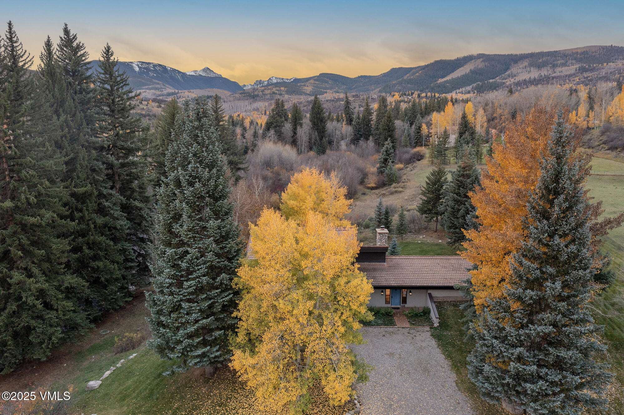 304 Meadow Road Edwards, CO 81632 - Photo 5 of 25 a view of a house with a yard and a garden