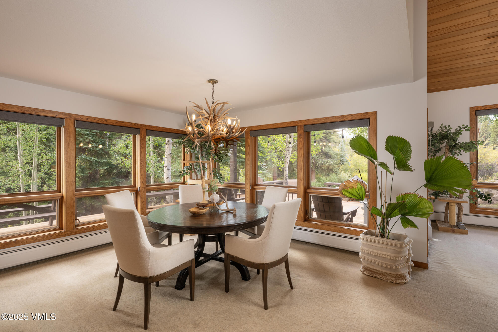 304 Meadow Road Edwards, CO 81632 - Photo 10 of 25 a dining room with furniture water view and a floor to ceiling window