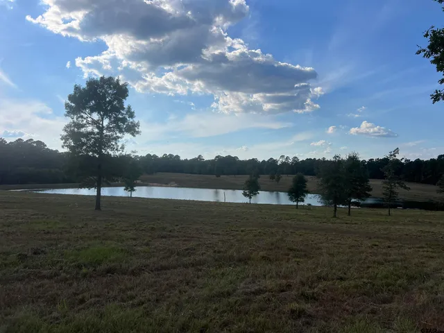 a view of a lake with sunset