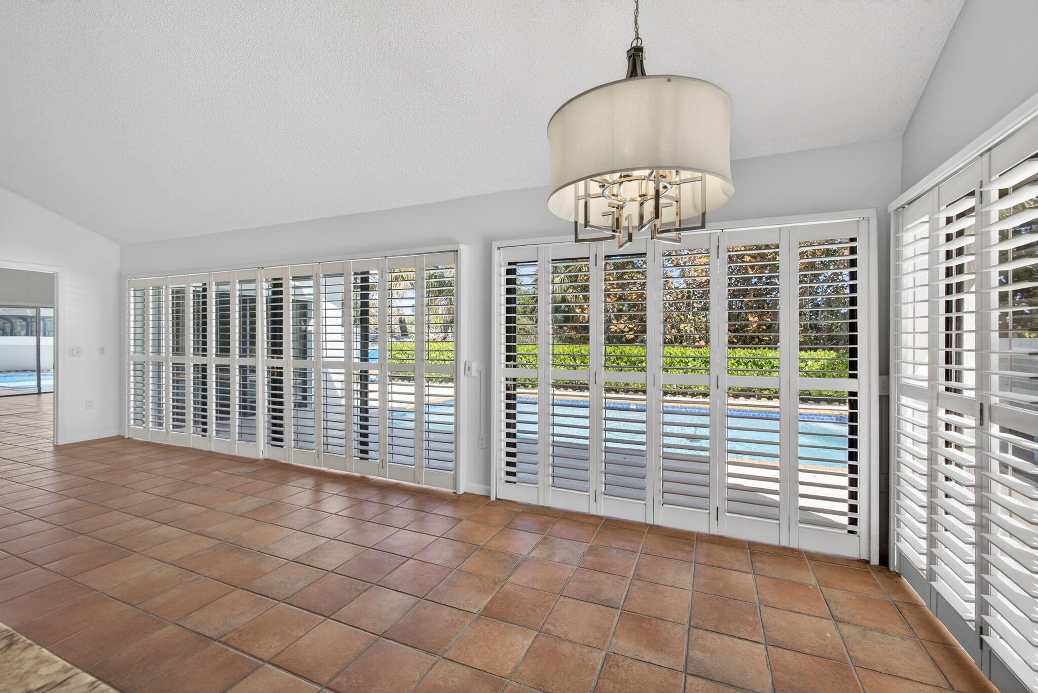 239 Ridge Road Jupiter, FL 33477 - Photo 11 of 75 a view of an empty room with a window