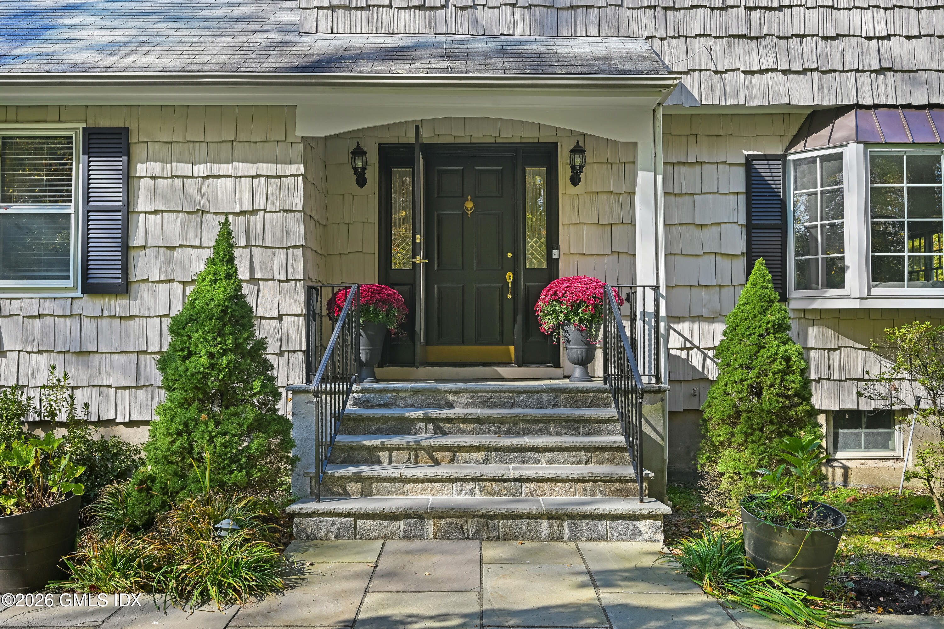 38 Bedford Road Greenwich, CT 06831 - Photo 5 of 32 a view of a house with potted plants