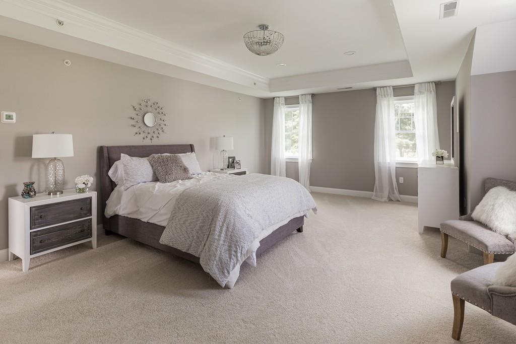 7 Summit Pointe Drive Holliston, MA 01746 - Photo 13 of 24 a spacious bedroom with a bed and furniture