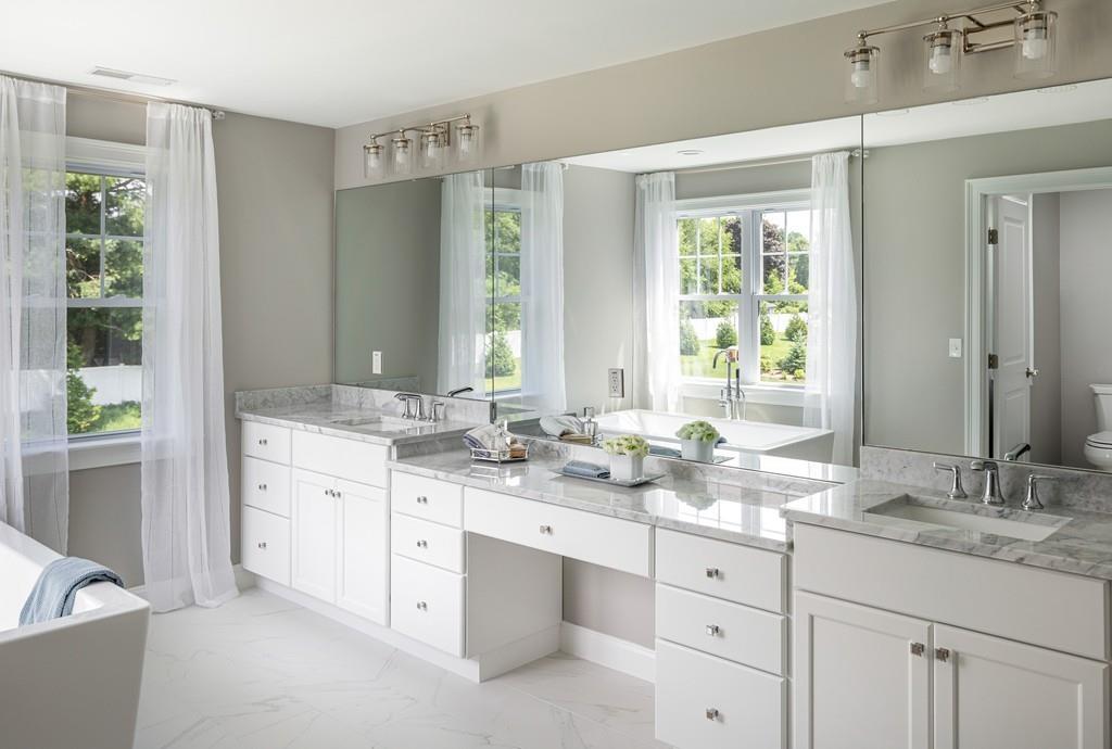 7 Summit Pointe Drive Holliston, MA 01746 - Photo 15 of 24 a bathroom with double sink and a mirror