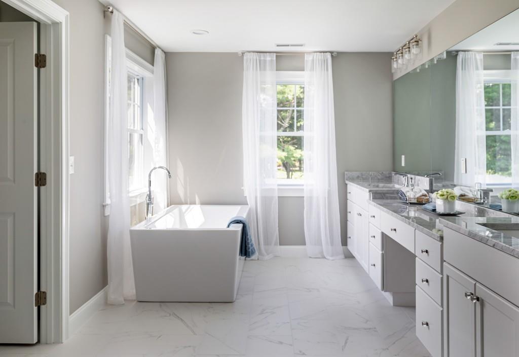 7 Summit Pointe Drive Holliston, MA 01746 - Photo 16 of 24 a spacious bathroom with a tub sink and mirror