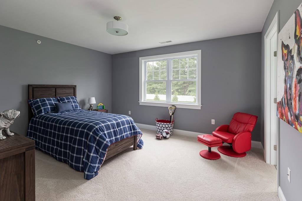 7 Summit Pointe Drive Holliston, MA 01746 - Photo 19 of 24 a bedroom with a bed and window