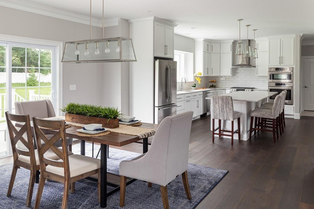 7 Summit Pointe Drive Holliston, MA 01746 - Photo 4 of 24 a view of a dining room with furniture window and wooden floor