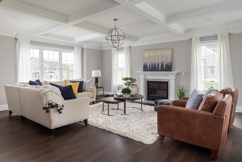 7 Summit Pointe Drive Holliston, MA 01746 - Photo 6 of 24 a living room with furniture and a fireplace