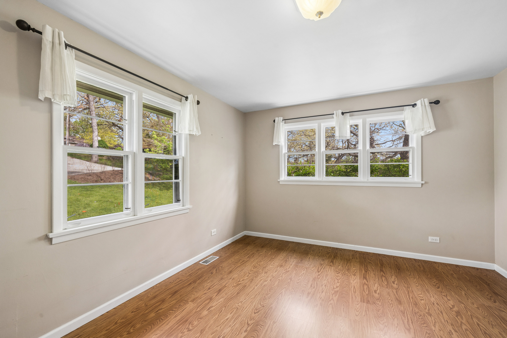 809 Ridgeland Street Fox River Grove, IL 60021 - Photo 18 of 50 a view of an empty room with a window and wooden floor