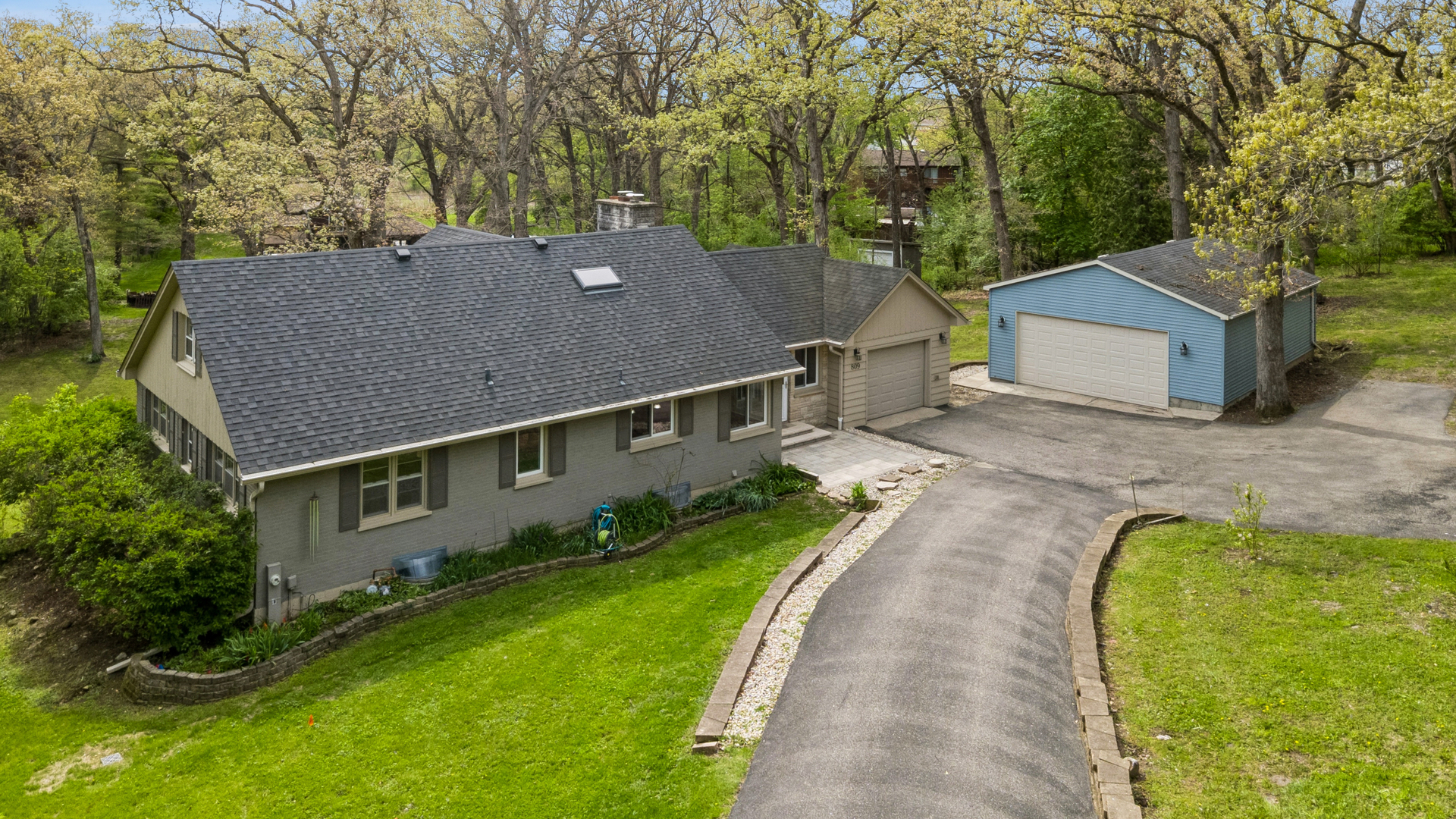 809 Ridgeland Street Fox River Grove, IL 60021 - Photo 6 of 50 a aerial view of a house next to a big yard and large trees