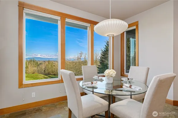 a dining room with furniture and window