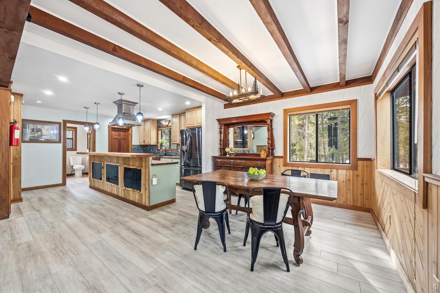 51379 Donner Pass Road Soda Springs, CA 95728 - Photo 4 of 22 a kitchen with stainless steel appliances wooden floors and wooden cabinets