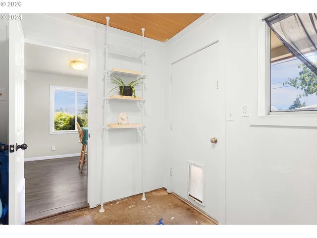 a swimming pool with an outdoor space and seating area