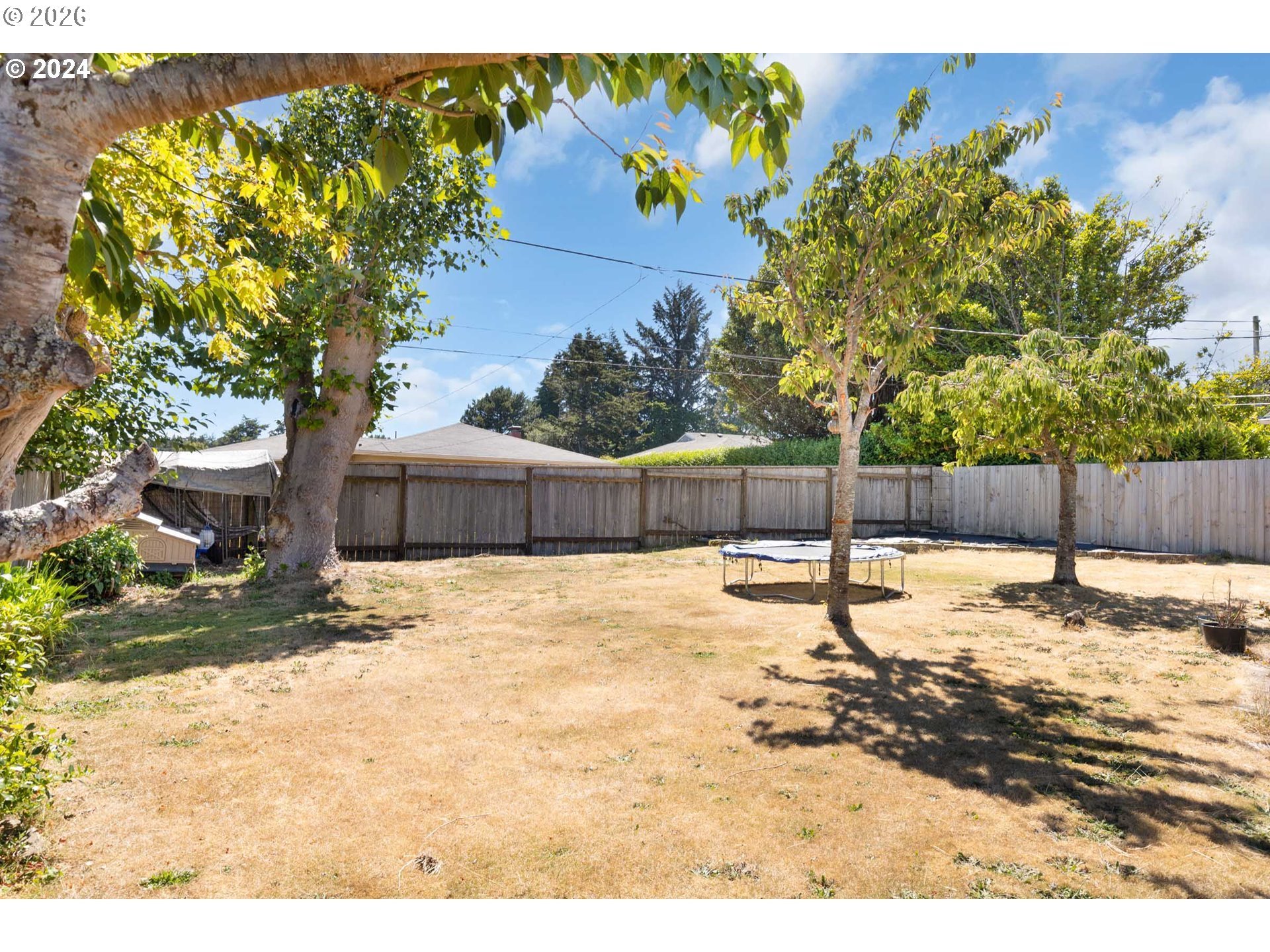 1669 Hayes Street North Bend, OR 97459 - Photo 21 of 30 a backyard of a house with lots of green space