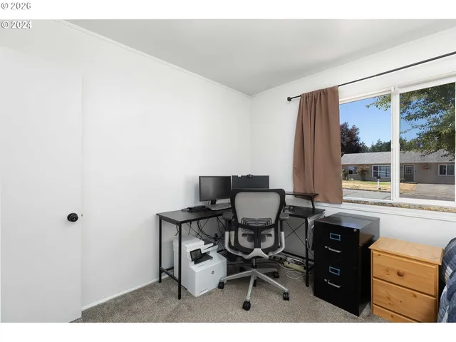 a kitchen with a table and chairs in it