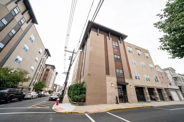 a view of a tall building along the street