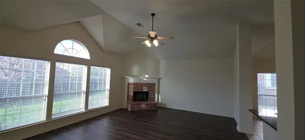 a kitchen with stainless steel appliances granite countertop a stove and a microwave