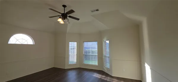 a view of a livingroom with wooden floor