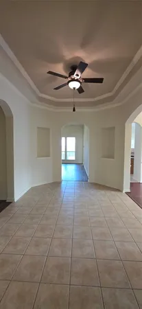 a view of entryway and hall with a chandelier