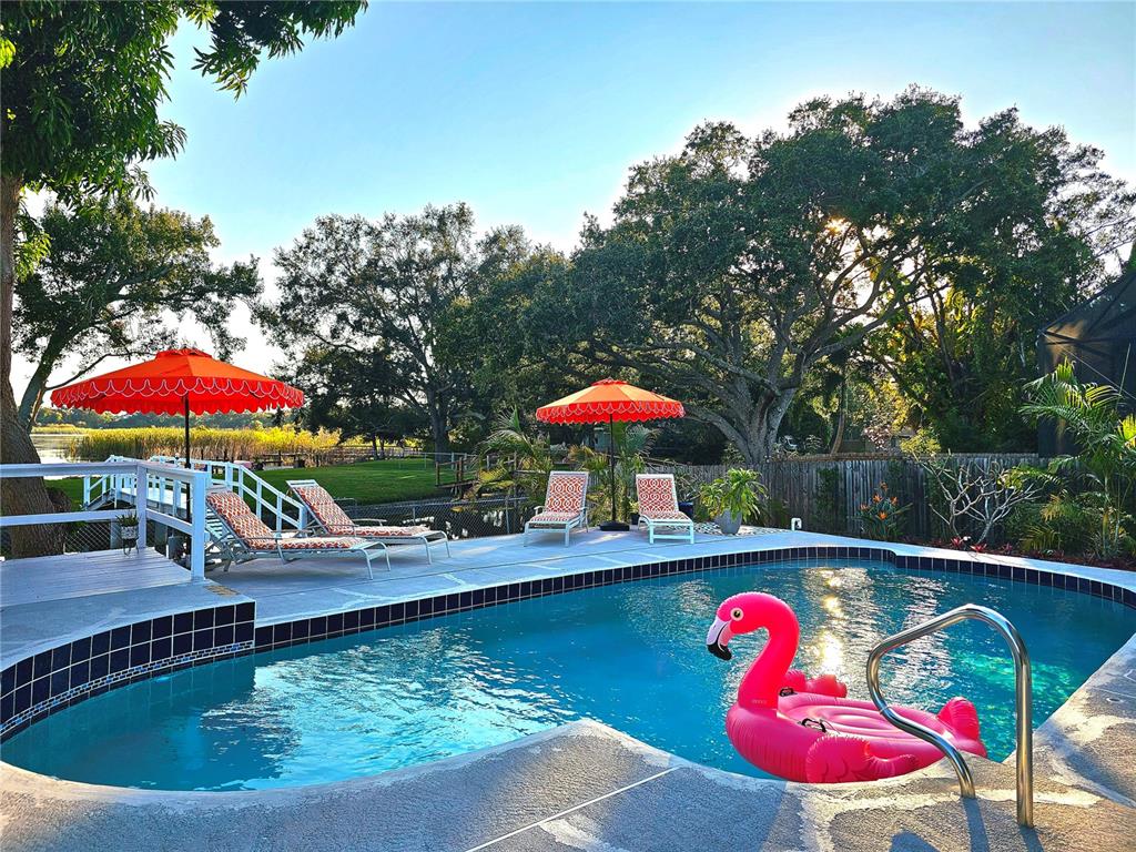 2153 Karan Way Clearwater, FL 33763 - Photo 47 of 65 an outdoor space with swimming pool and furniture