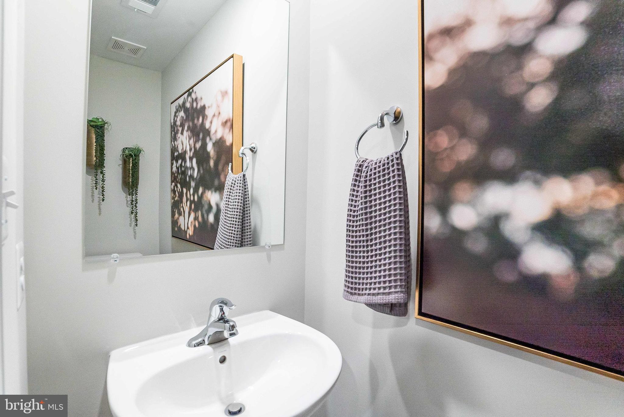 1252 Red Clover Lane Ranson, WV 25438 - Photo 5 of 24 a bathroom with a bathtub and a sink