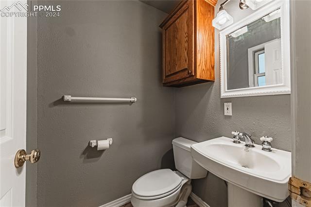 1027 County Road LL Fowler, CO 81039 - Photo 18 of 37 Bathroom with sink and toilet
