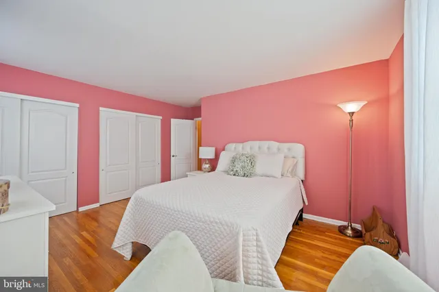 a bedroom with a bed and closet