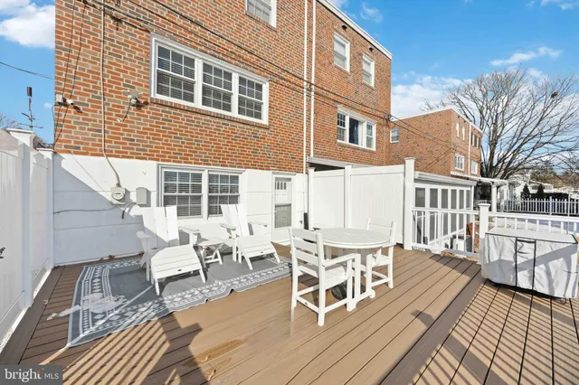 a view of a patio with a table and chairs