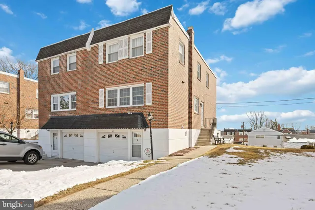 a view of parking space in front of building