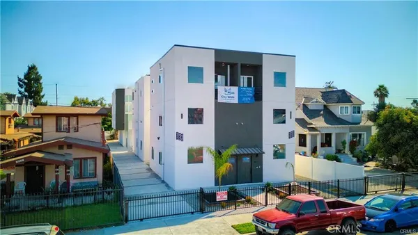 a front view of a house with sitting area