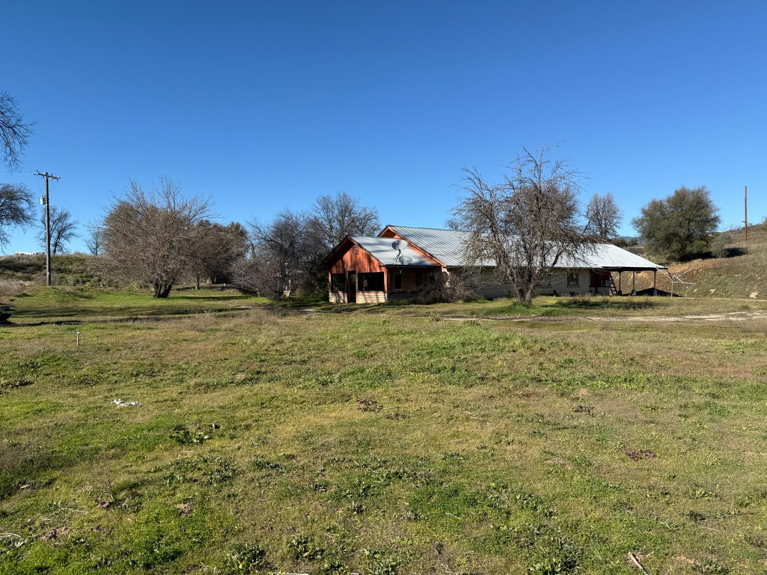 40163 Highway 49 Oakhurst, CA 93644 - Photo 1 of 6 a view of a field with an trees