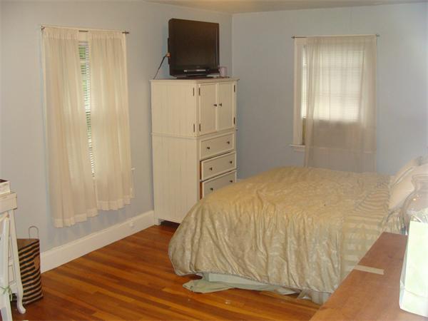 76 Cloverdale Road Newton, MA 02461 - Photo 11 of 14 a bedroom with a bed and a flat screen tv