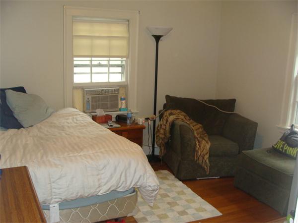 76 Cloverdale Road Newton, MA 02461 - Photo 13 of 14 a bed sitting in a bedroom next to a window