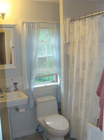 76 Cloverdale Road Newton, MA 02461 - Photo 14 of 14 a white toilet sitting next to a bathroom sink