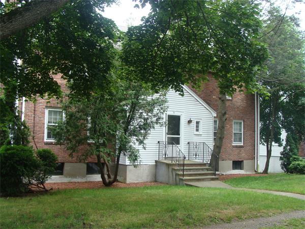 76 Cloverdale Road Newton, MA 02461 - Photo 2 of 14 a front view of house with yard and green space