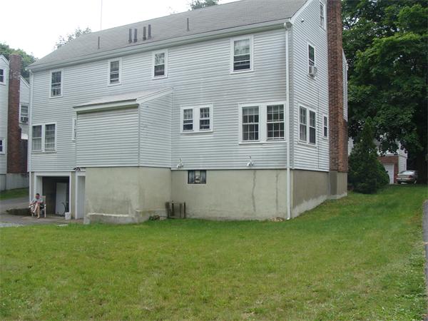 76 Cloverdale Road Newton, MA 02461 - Photo 3 of 14 front view of a house with a yard
