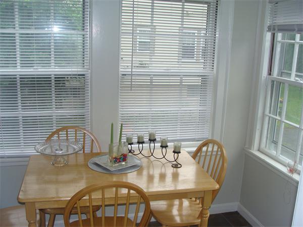 76 Cloverdale Road Newton, MA 02461 - Photo 8 of 14 a view of a dining room with furniture and window
