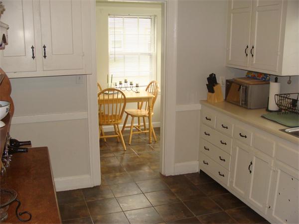 76 Cloverdale Road Newton, MA 02461 - Photo 10 of 14 a kitchen with stainless steel appliances a refrigerator and cabinets