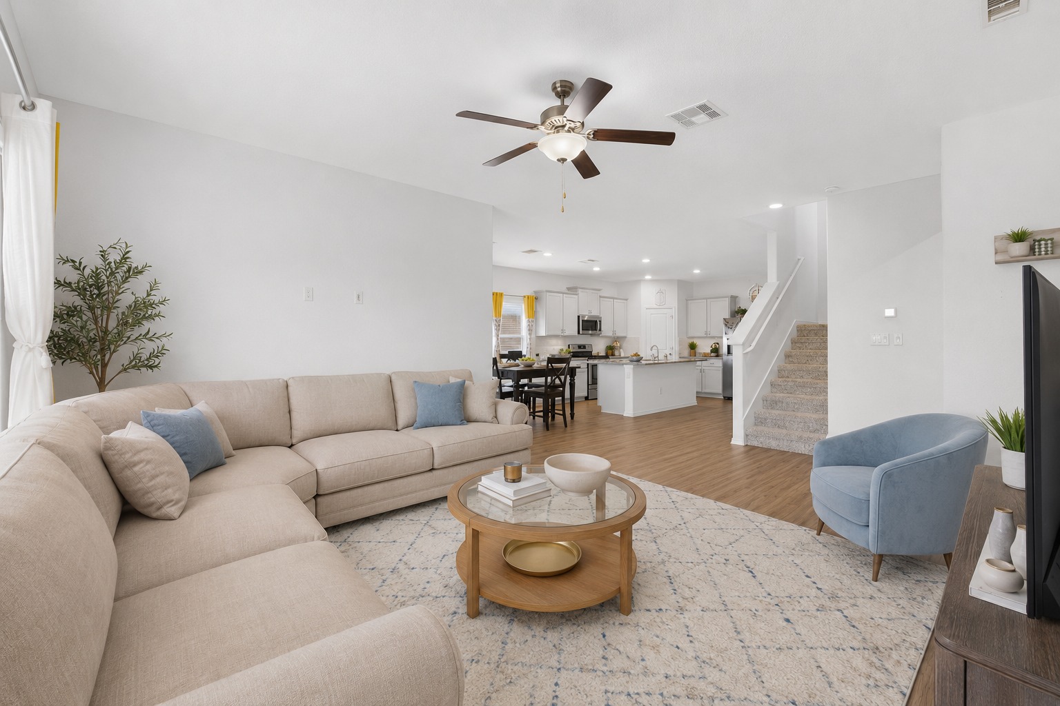 936 Mallow Road Leander, TX 78641 - Photo 6 of 16 Expansive open-concept living space featuring wood-finish flooring, recessed lighting, and a ceiling fan