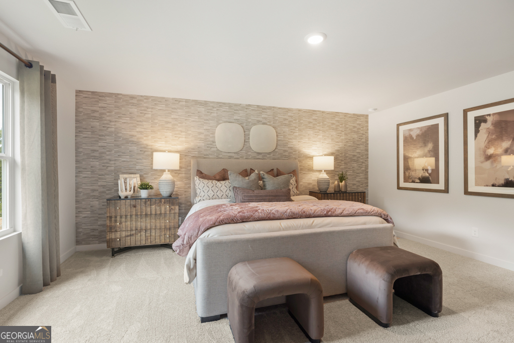 5412 Aurora Trail Flowery Branch, GA 30542 - Photo 20 of 36 a bedroom with a bed and window